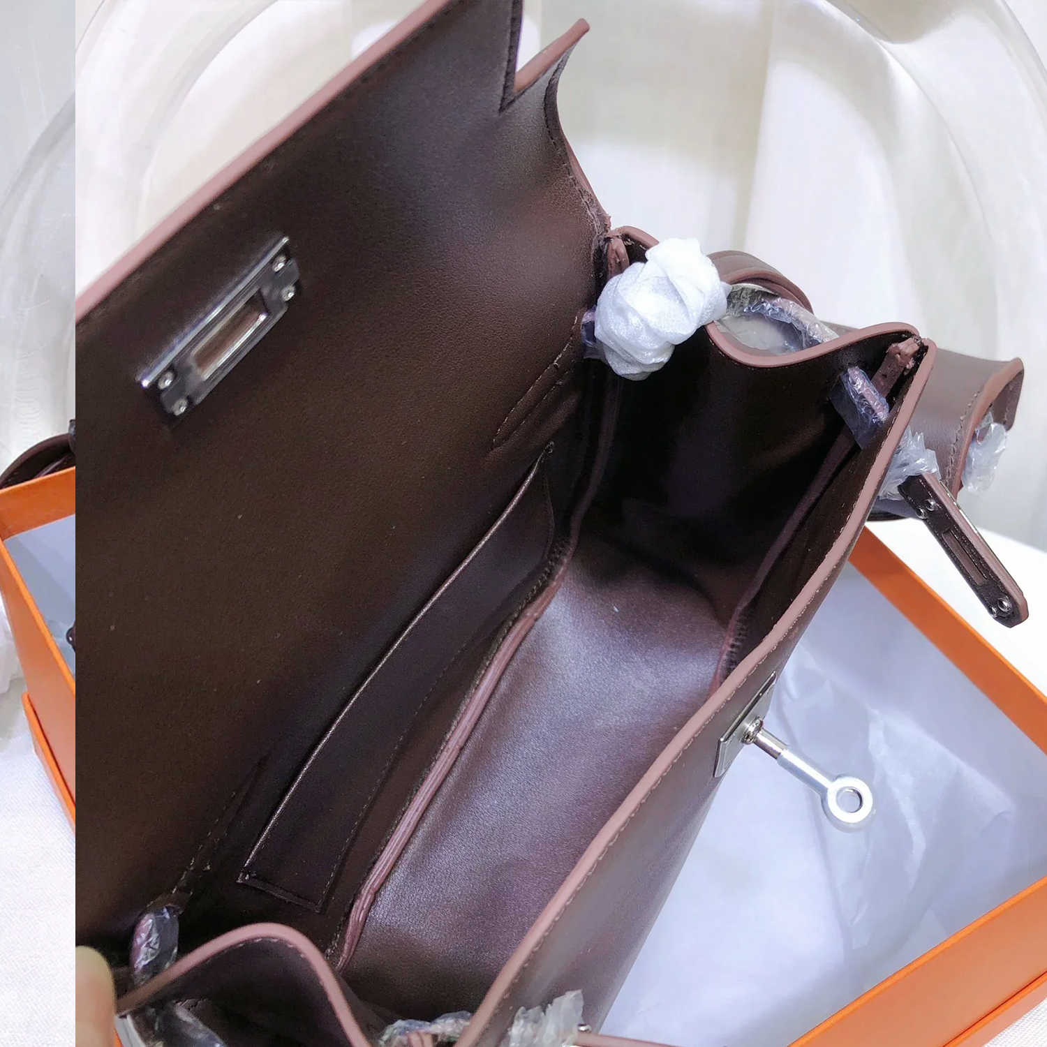 Rich Deep Chocolate Brown Sleek Smooth Compact Vertical Backpack With Pale Contrast Stitching And Polished Silvery Twist Lock Flap Hardware