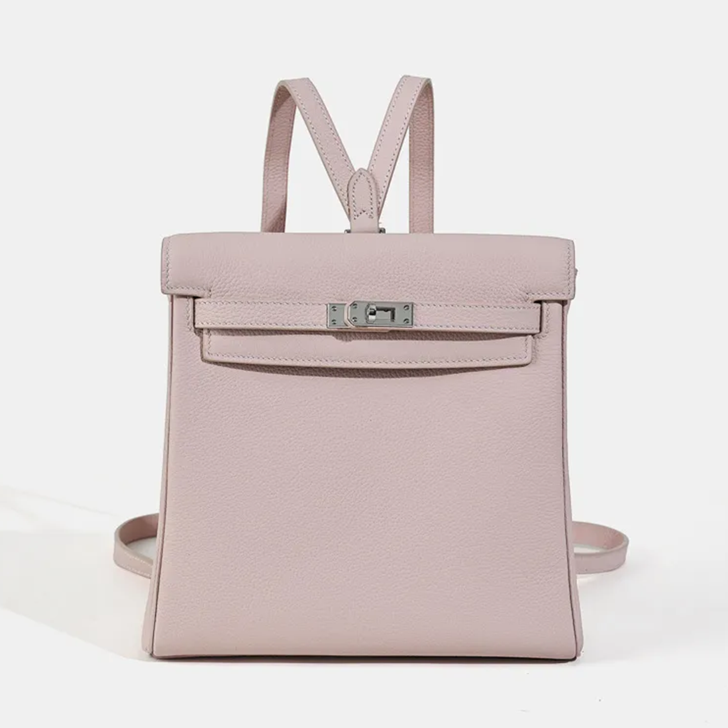 Soft Pale Mauve Fine Matte Grain Vertical Compact Backpack With Sleek Silvery Twist Flap Hardware And Slim Matching Back Rest Straps